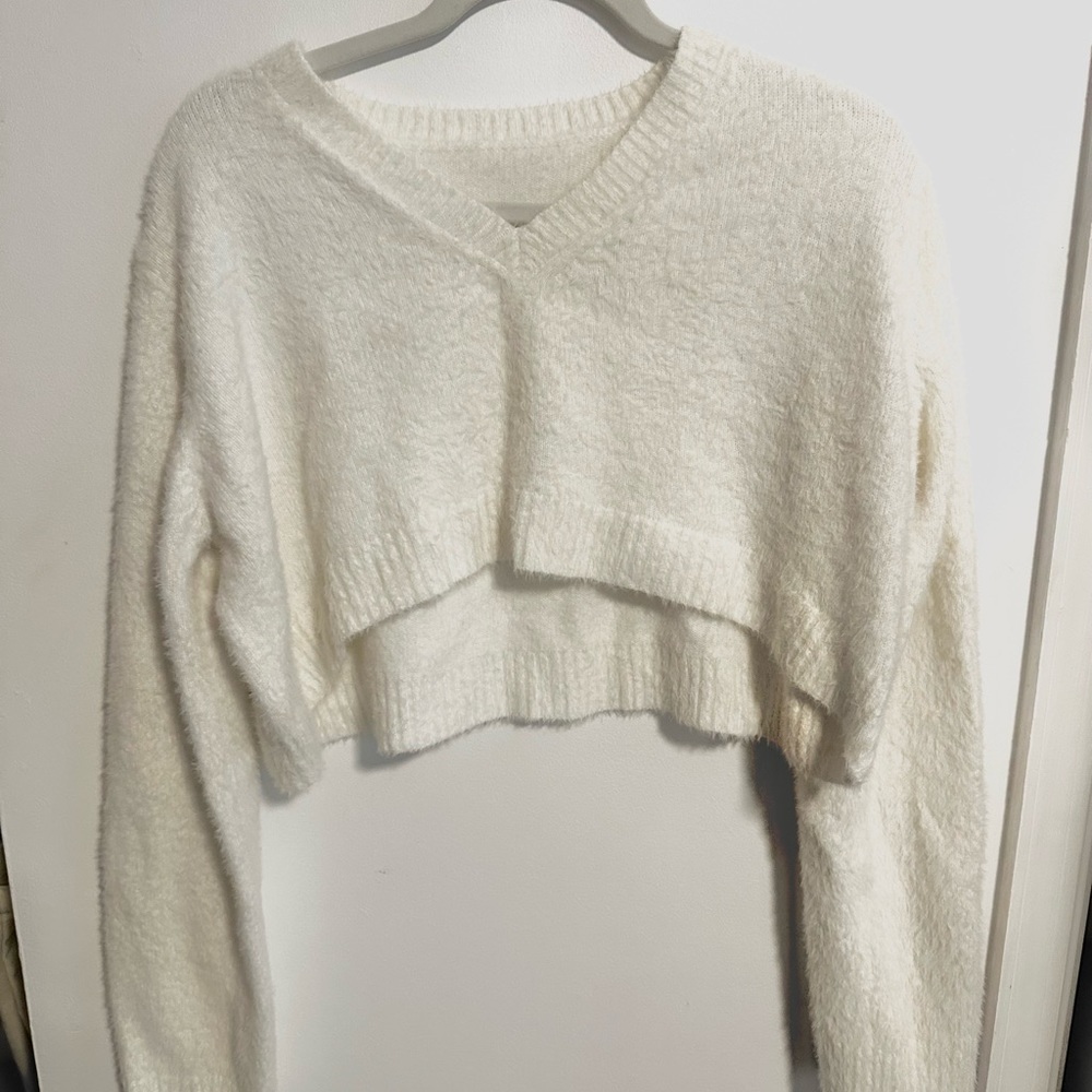 extremely soft and fuzzy cropped sweater. So cute size small.